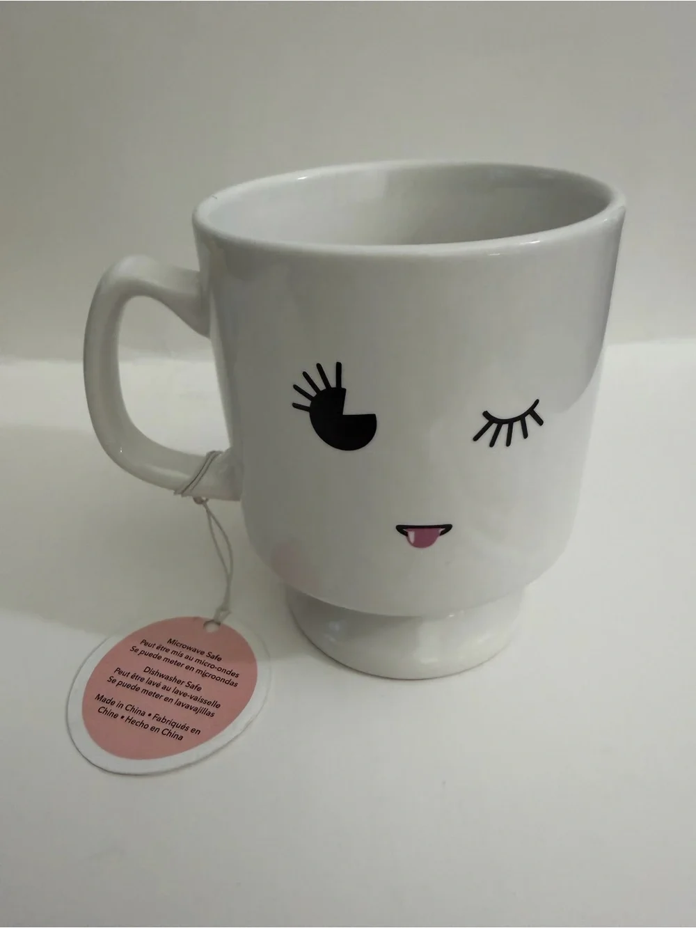 White Ceramic Pedestal Mug with Playful Face